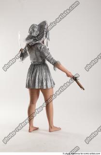 2020 01 LUCI AVIOL STANDING POSE WITH GUN AND SWORD…